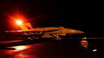 A US fighter jet takes off to strike Houthi strongholds.