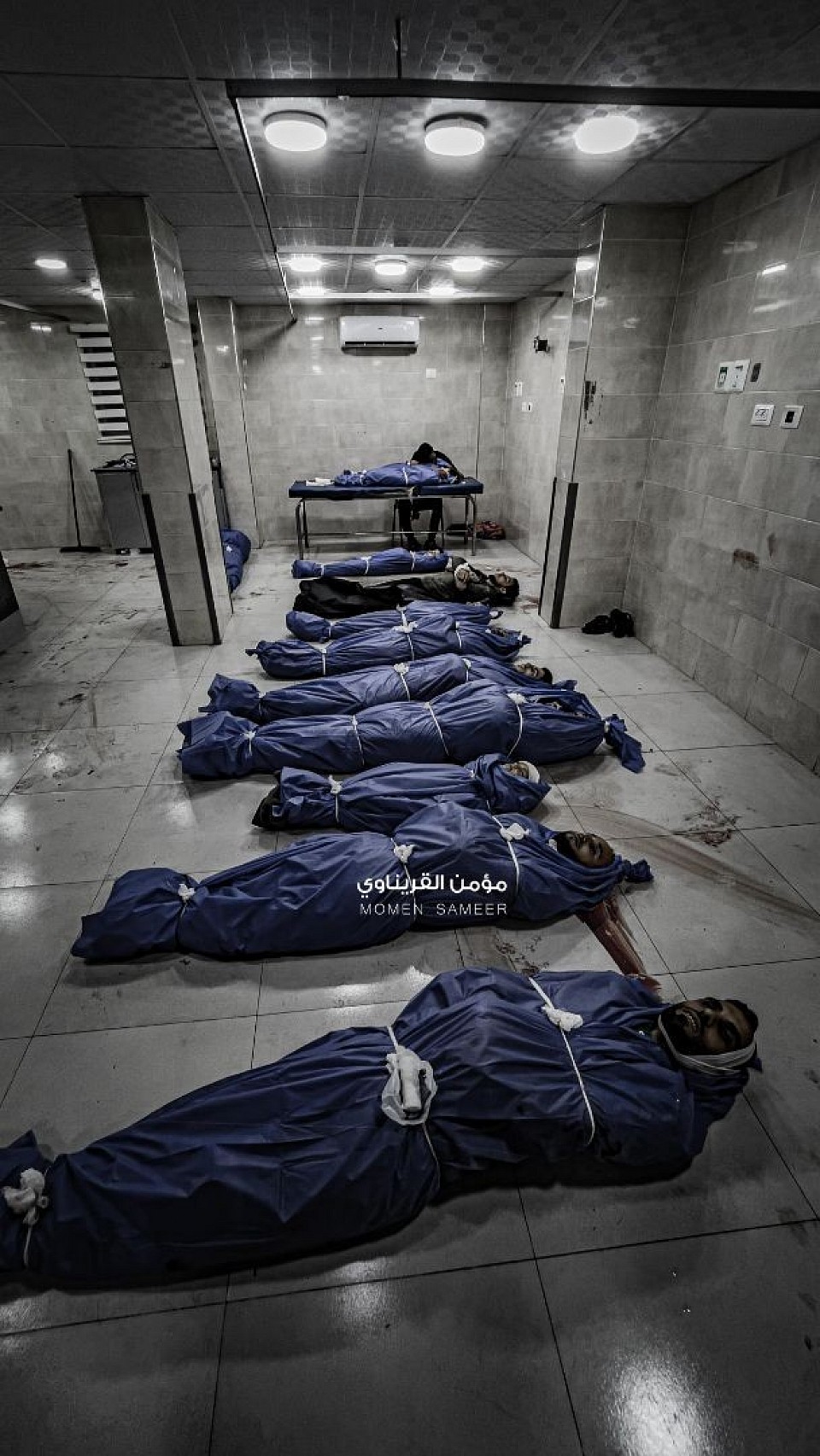 The bodies of the martyrs inside Al-Awda Hospital in the Nuseirat camp in the central Gaza Strip, as a result of the occupation's massacres in the camp.