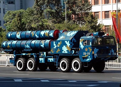 The image shows the HQ-9B in modern digital camouflage during a Chinese military parade.