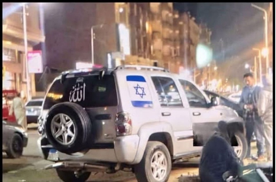 News reports indicate that Egyptian security forces arrested a young man after he was seen driving a car displaying an Israeli flag sticker in Giza. The sticker angered some local residents, who chased the car, surrounded it, smashed its windows, and caused damage.  Eyewitness accounts circulating on social media suggest that this reaction reflects a deep-seated public sensitivity and resentment toward Israel, particularly given the ongoing regional tensions. Egyptian authorities have reportedly launched an investigation into the incident to determine the circumstances and hold those responsible accountable.  Context  Public opinion in Egypt has long been complex regarding Israel, despite the 1979 peace treaty. Periods of escalating conflict in the region often exacerbate these sentiments.
